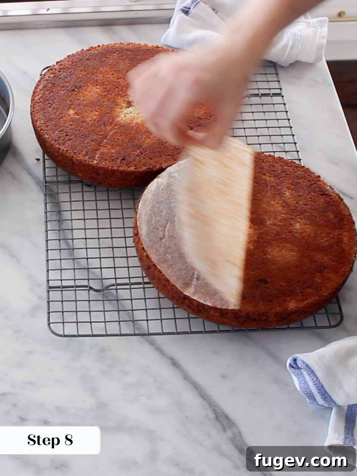 Sweet Nectar Delight 11 placing first cake layer on stand.