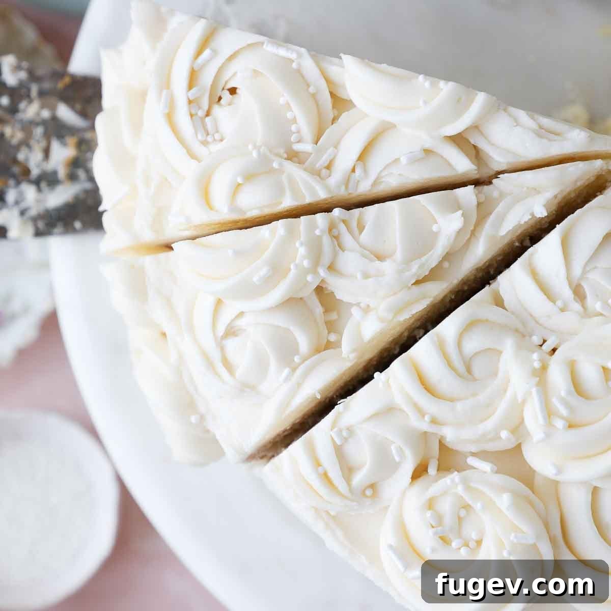 The Ultimate American Buttercream Recipe 5 Slices of moist vanilla cake generously frosted with light and fluffy American buttercream, ready to be enjoyed.