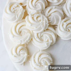 The Ultimate American Buttercream Recipe 9 Detailed view of elegant rosettes piped with American buttercream, showcasing a smooth texture and intricate design.