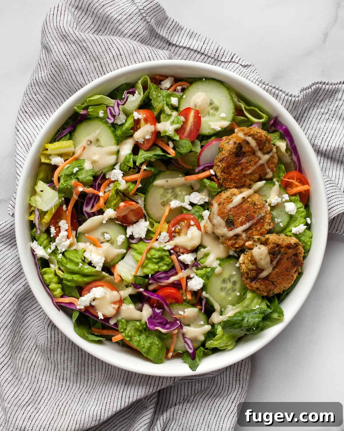 Mediterranean Baked Falafel Bowl 7 Baked falafel salad in a large serving bowl, ready to be enjoyed.