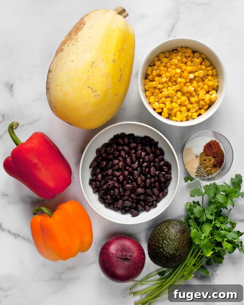 Fiesta Spaghetti Squash 3 A selection of fresh and pantry ingredients for Southwestern Spaghetti Squash, including spaghetti squash, bell peppers, black beans, corn, and spices.