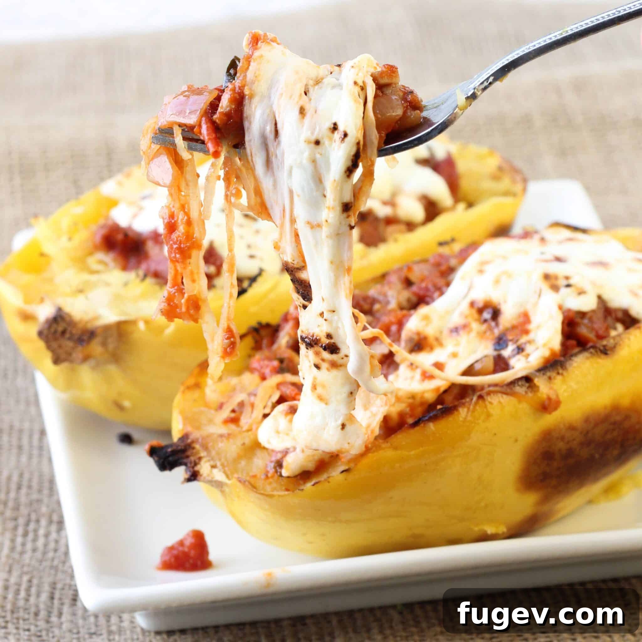 Golden Twice Baked Spaghetti Squash Bake 2 Twice Baked Spaghetti Squash with Turkey Sausage Meat Sauce - A healthy, hearty, and easy dinner idea.