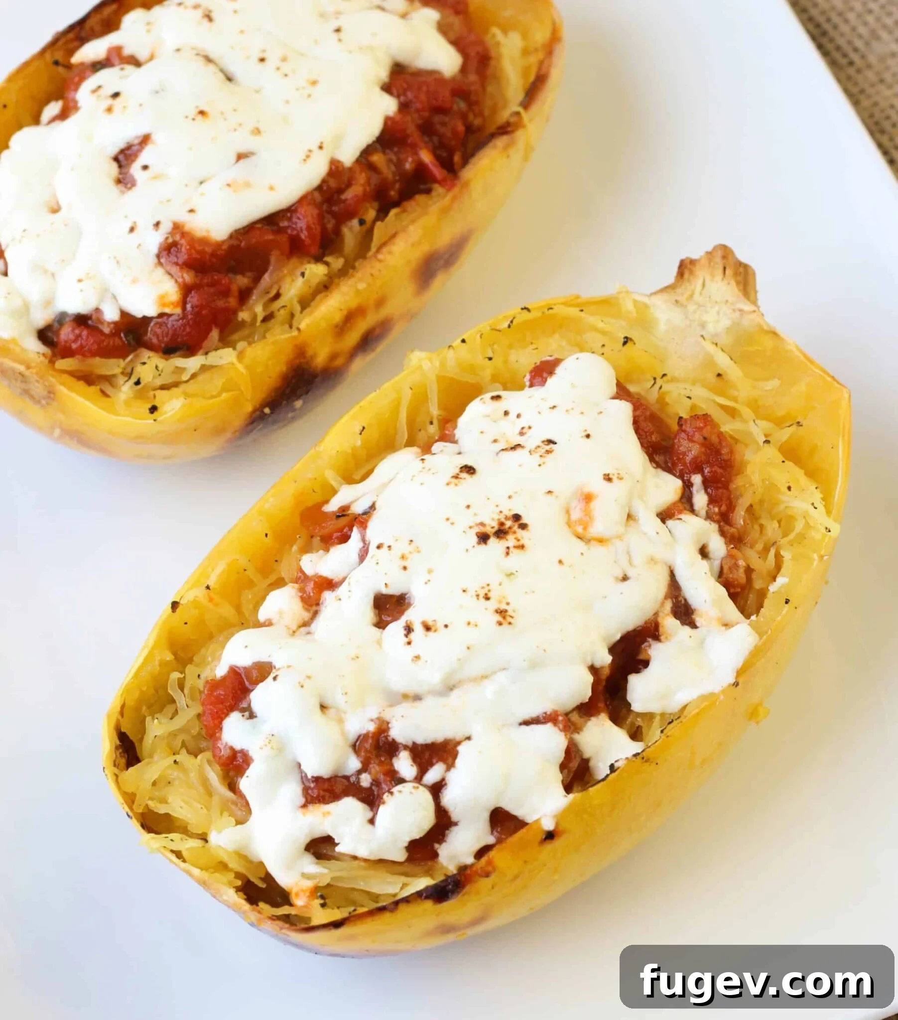 Golden Twice Baked Spaghetti Squash Bake 4 Three servings of Twice Baked Spaghetti Squash in their natural shells, topped with melted cheese and fresh herbs.