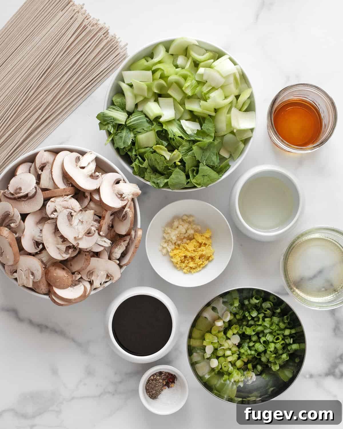 Earthy Mushroom & Crisp Bok Choy Soba Stir-Fry 3 A flat lay of all the fresh ingredients needed for the stir-fry: bok choy, mushrooms, soba noodles, scallions, garlic, ginger, and various spices.