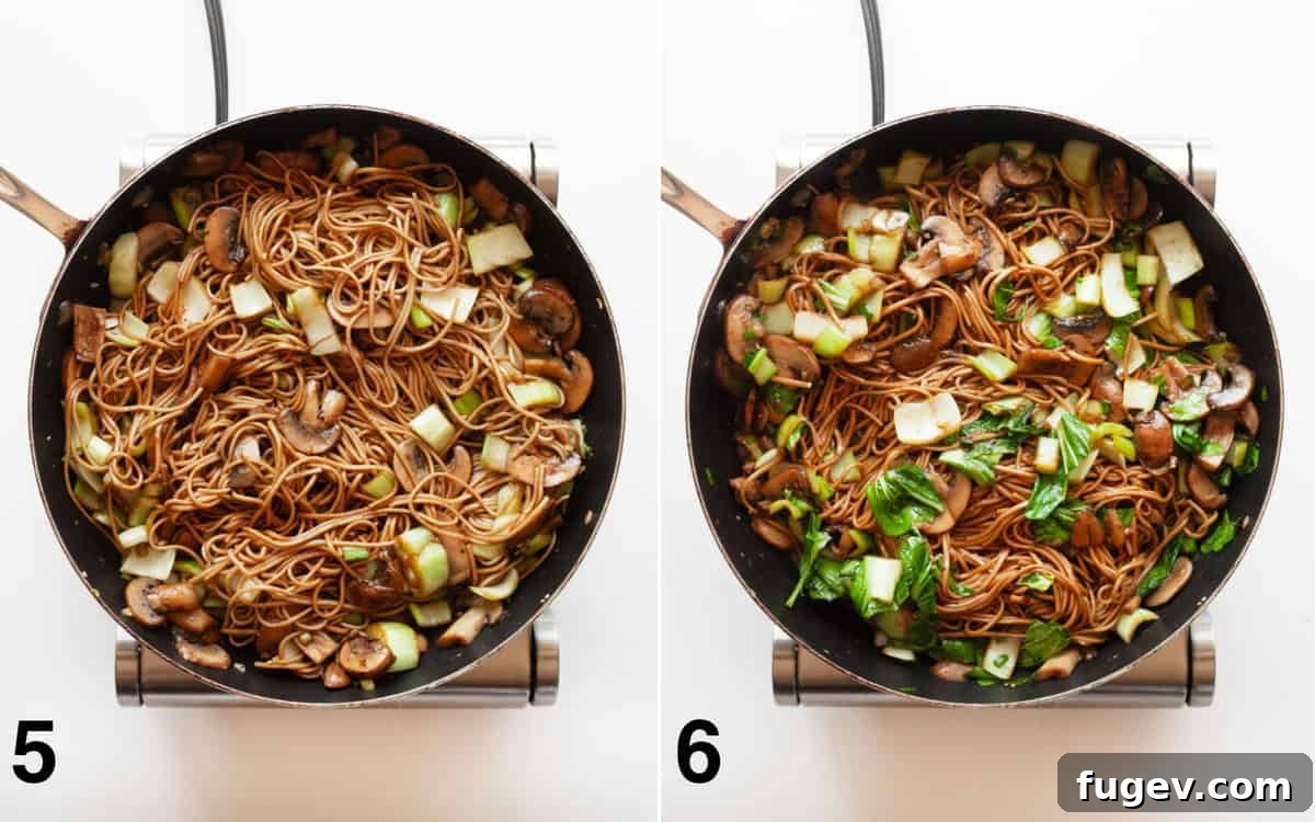 Earthy Mushroom & Crisp Bok Choy Soba Stir-Fry 6 Soba noodles and sauce being stirred into the sautéed vegetables, followed by the addition of bok choy leaves and green scallions to the finished dish.