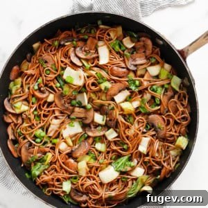 Earthy Mushroom & Crisp Bok Choy Soba Stir-Fry 8 Mushroom and bok choy soba noodle stir-fry in a skillet.