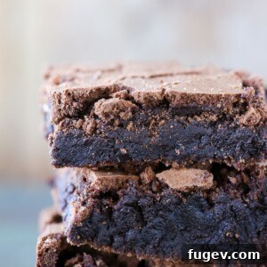 Detailed view of a single brown butter brownie, highlighting its rich, crackled surface.
