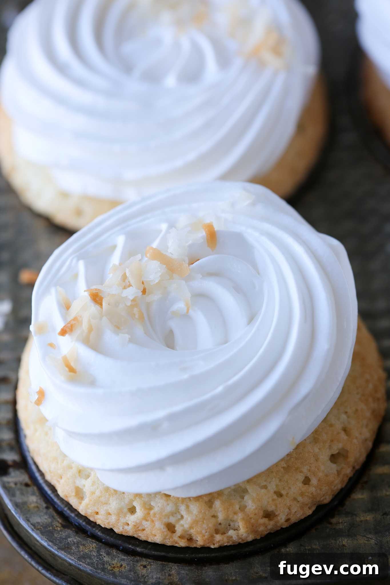 Whipped Marshmallow Dream 3 fluff piped on cupcakes.