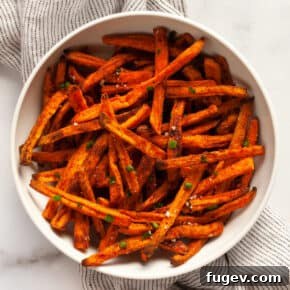 Oven-baked sweet potato fries on a plate.