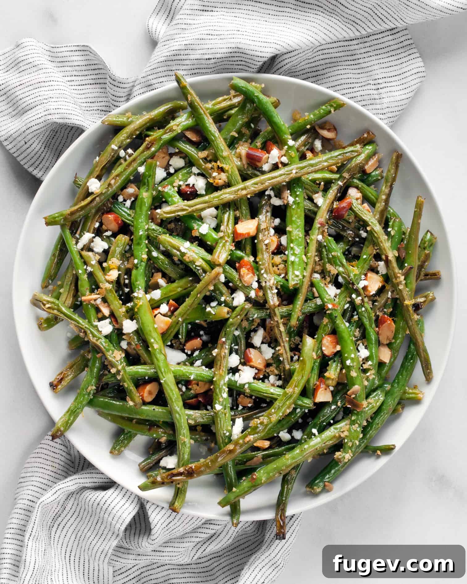 Almond Crusted Roasted Green Beans 2 Delicious Roasted Green Beans with Almond Breadcrumbs and Feta, beautifully plated and ready to serve.
