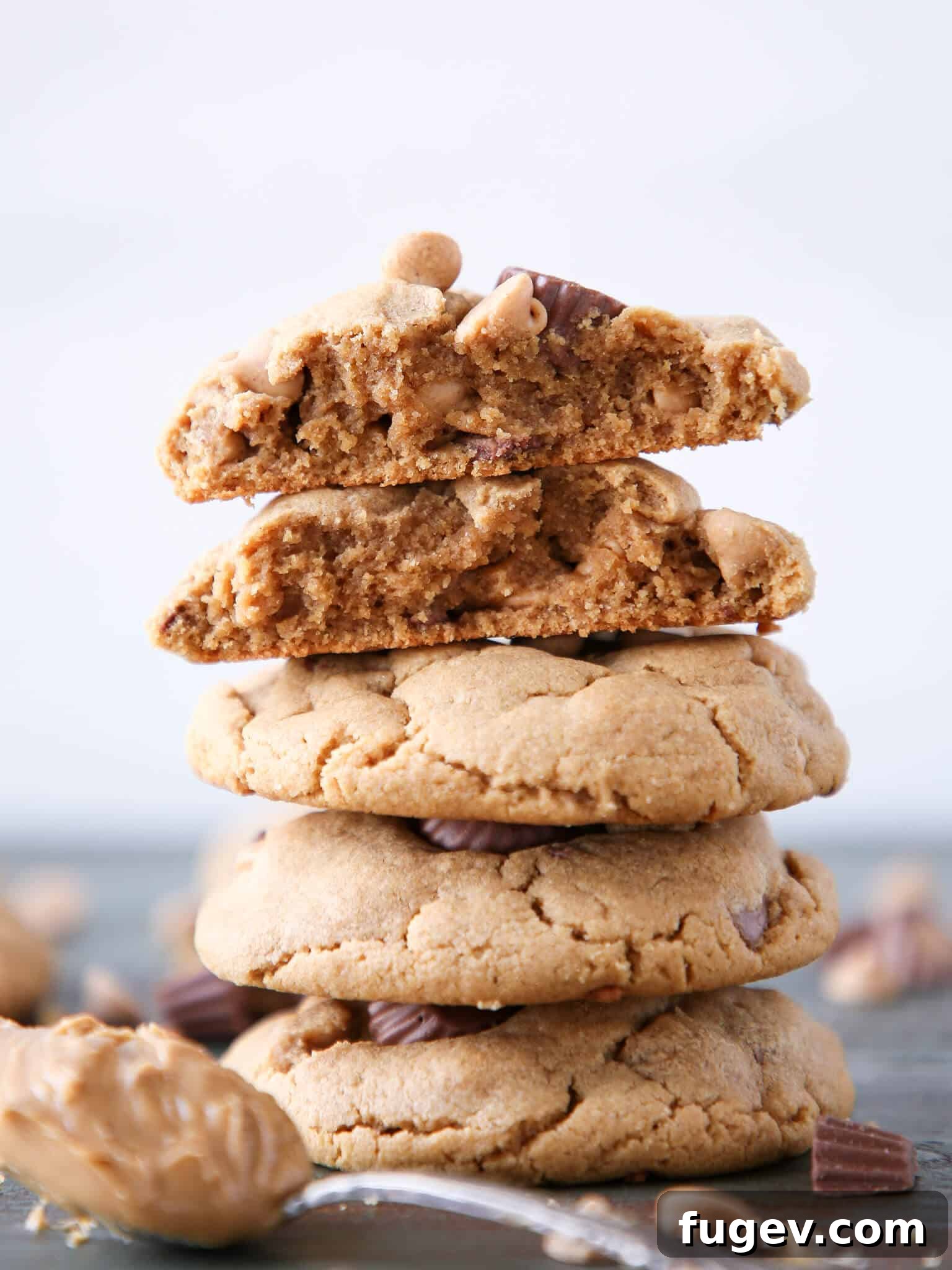 Irresistible Reese's Peanut Butter Cookies 4 A tall stack of freshly baked Reese's Peanut Butter Cookies, showing their impressive thickness.