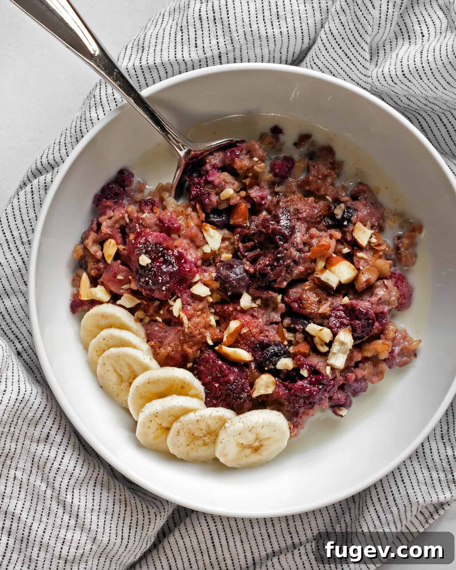 Baked Berry Steel-Cut Oats 3 Close-up of Berry Baked Steel-Cut Oatmeal with a Spoonful
