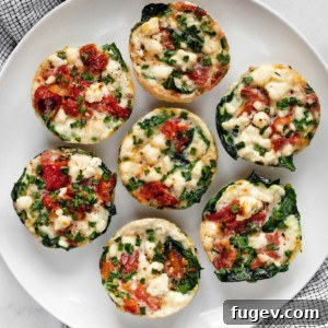 Fluffy Spinach Feta Protein Poppers 7 Spinach feta egg white cups on a plate, ready to be served.