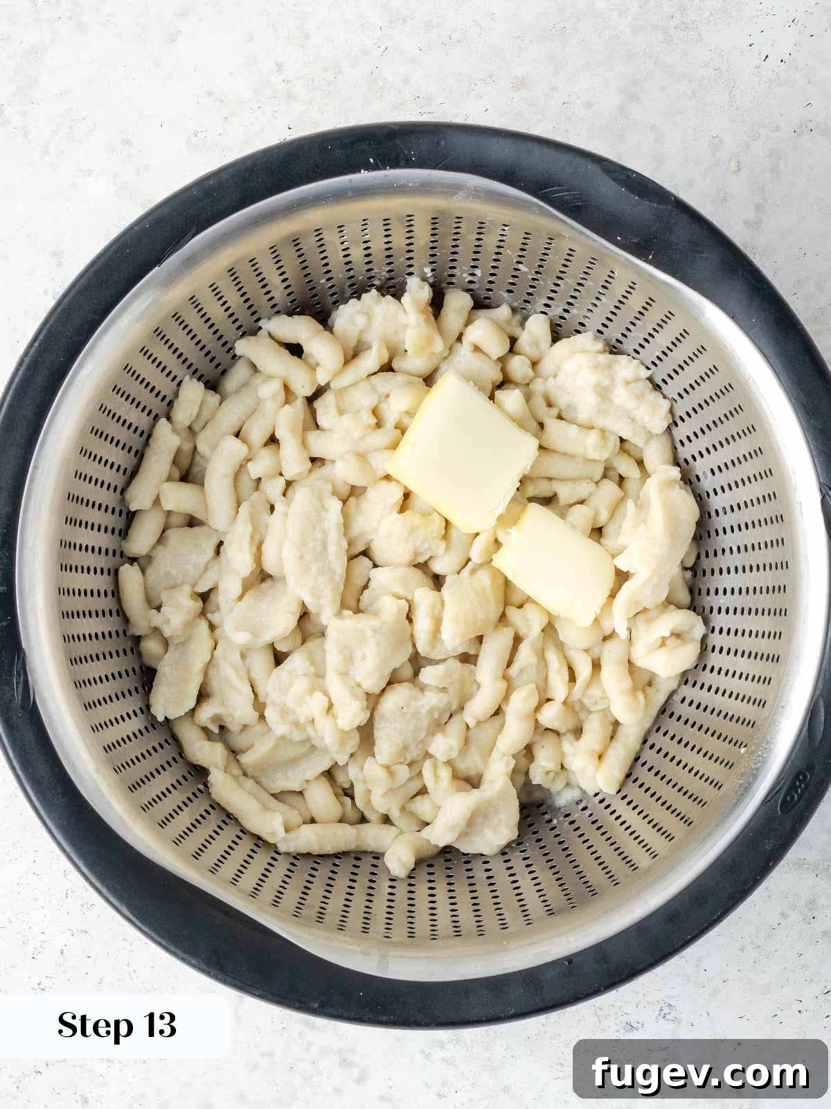 Grandma's Hungarian Chicken Paprikash 12 Cooked spaetzle in a colander, tossed with a bit of butter to prevent sticking.