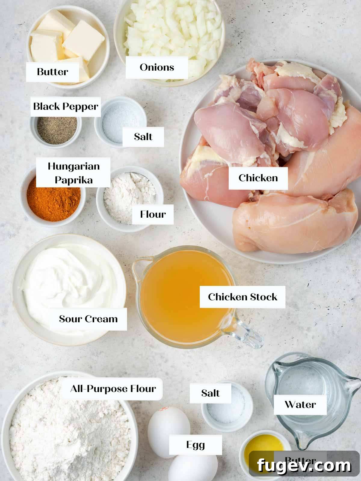 Grandma's Hungarian Chicken Paprikash 3 Collection of fresh ingredients for Chicken Paprikash including chicken, onions, paprika, sour cream, and butter.