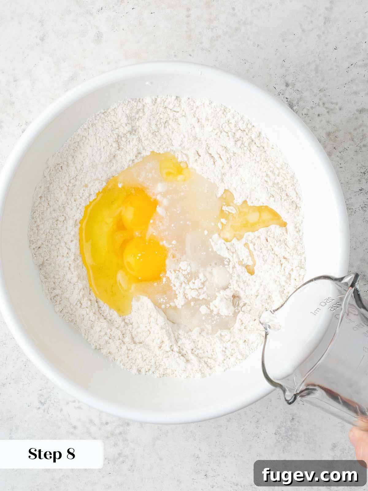Grandma's Hungarian Chicken Paprikash 10 Ingredients for spaetzle batter in a bowl, showing flour, eggs, and butter.