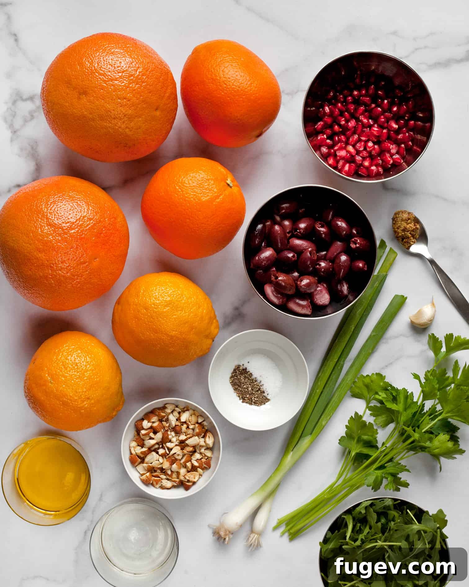 Vibrant Citrus Salad with Briny Olives and Pomegranate Jewels 3 Ingredients including grapefruit, oranges, almonds, olives, pomegranate seeds, and scallions