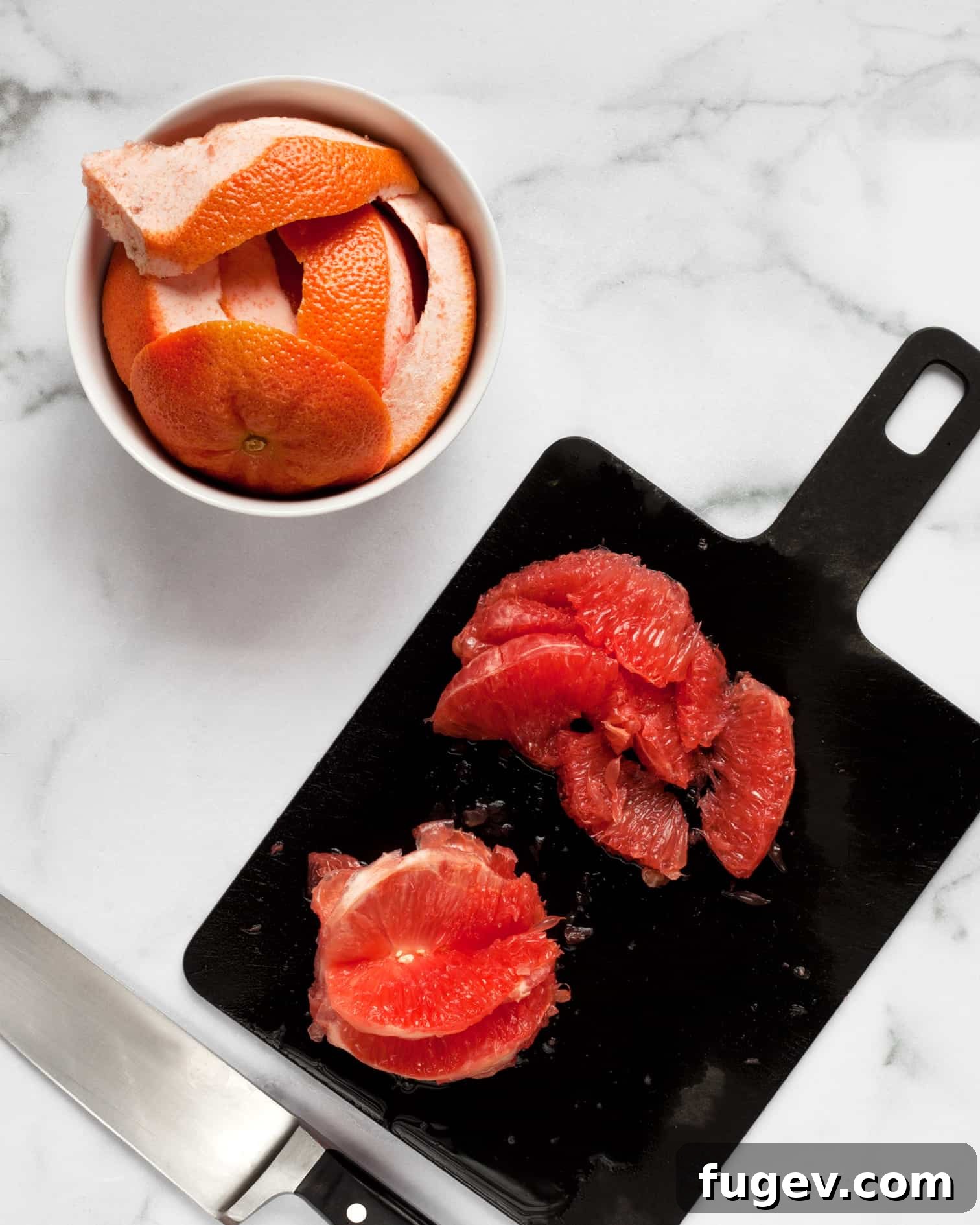 Vibrant Citrus Salad with Briny Olives and Pomegranate Jewels 4 Peeling and cutting the segments from grapefruit