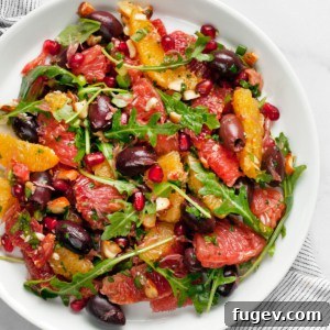 Vibrant Citrus Salad with Briny Olives and Pomegranate Jewels 7 Citrus salad on a plate.