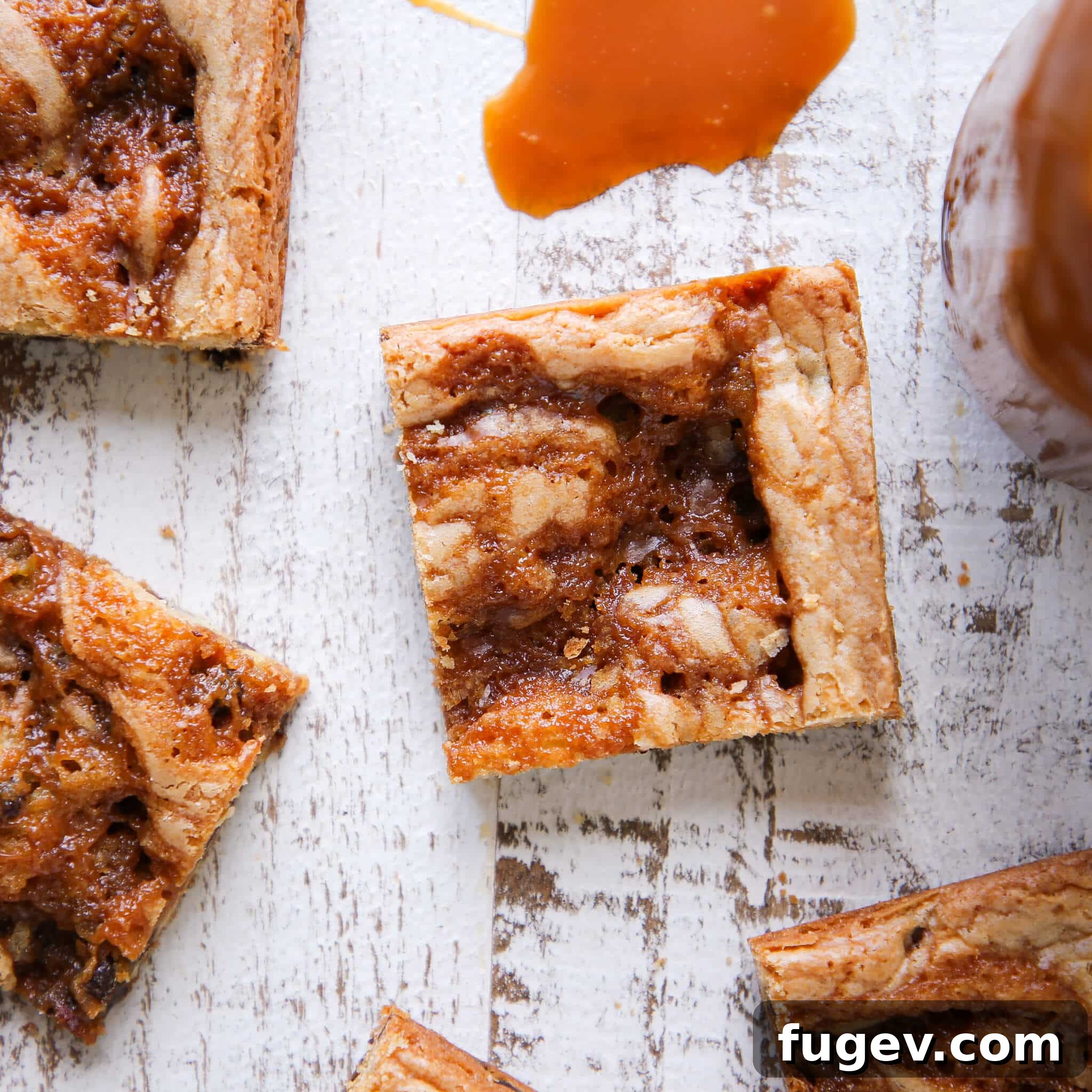 Chewy Caramel Chocolate Chip Blondies 5 Caramel Chocolate Chip Blondies sliced on white wooden board