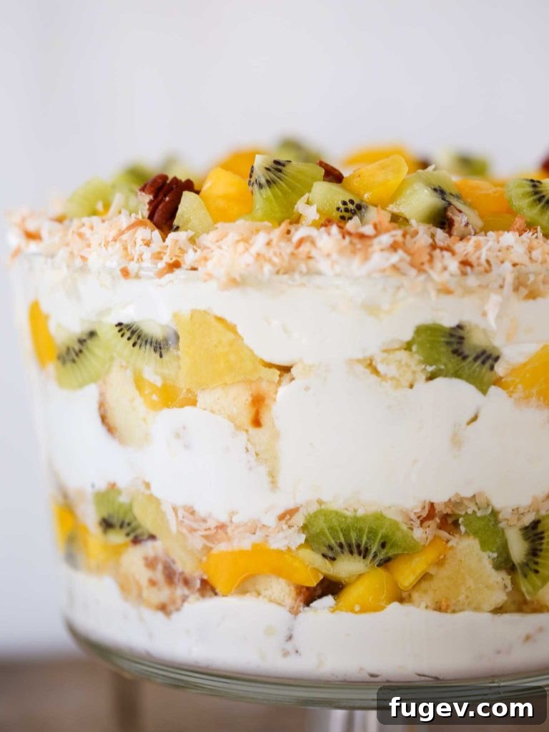 Paradise Trifle Delight 6 A large dessert bowl filled with Tropical Trifle, showing colorful fruit and creamy layers