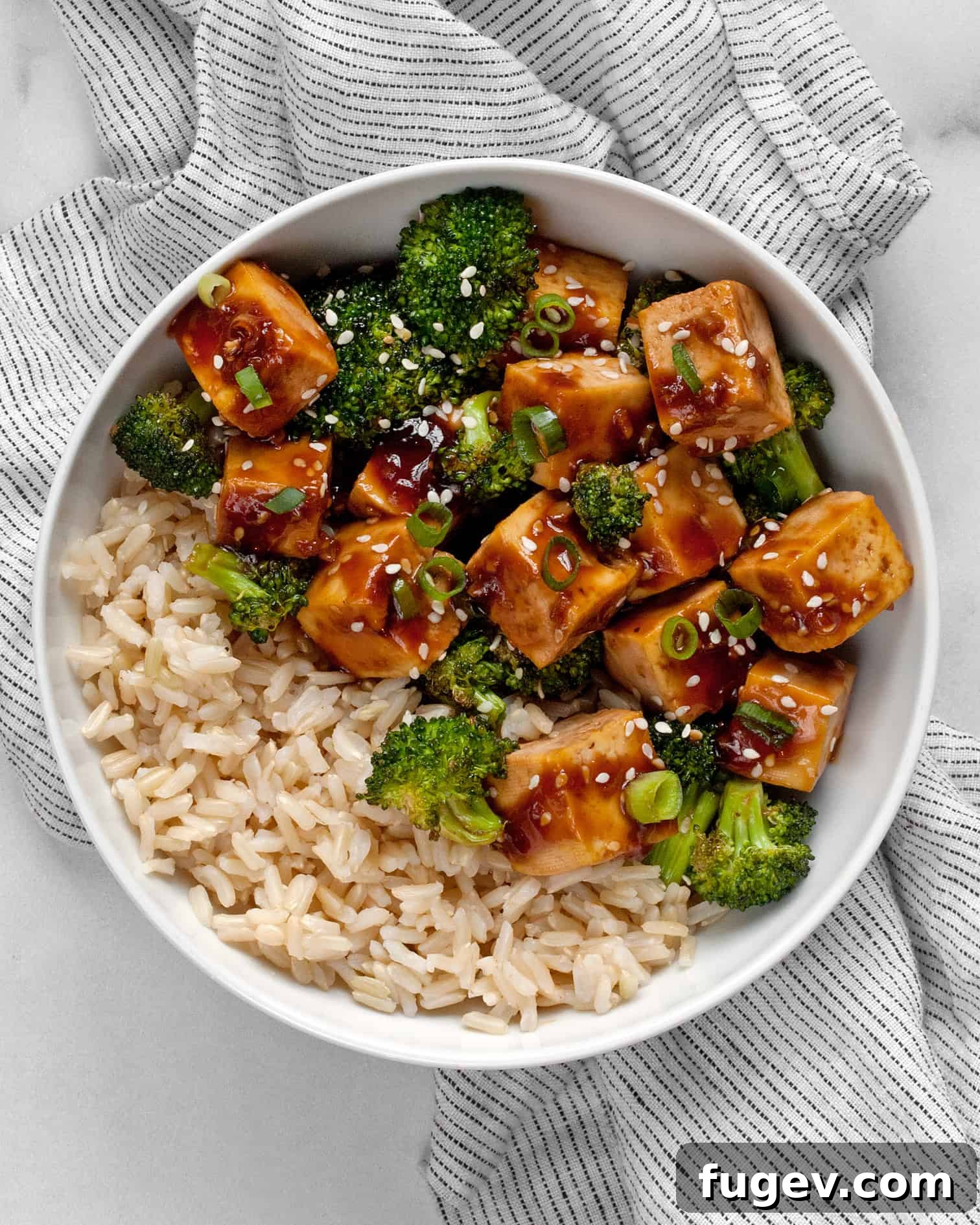 Sticky Honey Garlic Tofu Broccoli Bake 6 Honey garlic tofu and broccoli in a bowl with brown rice
