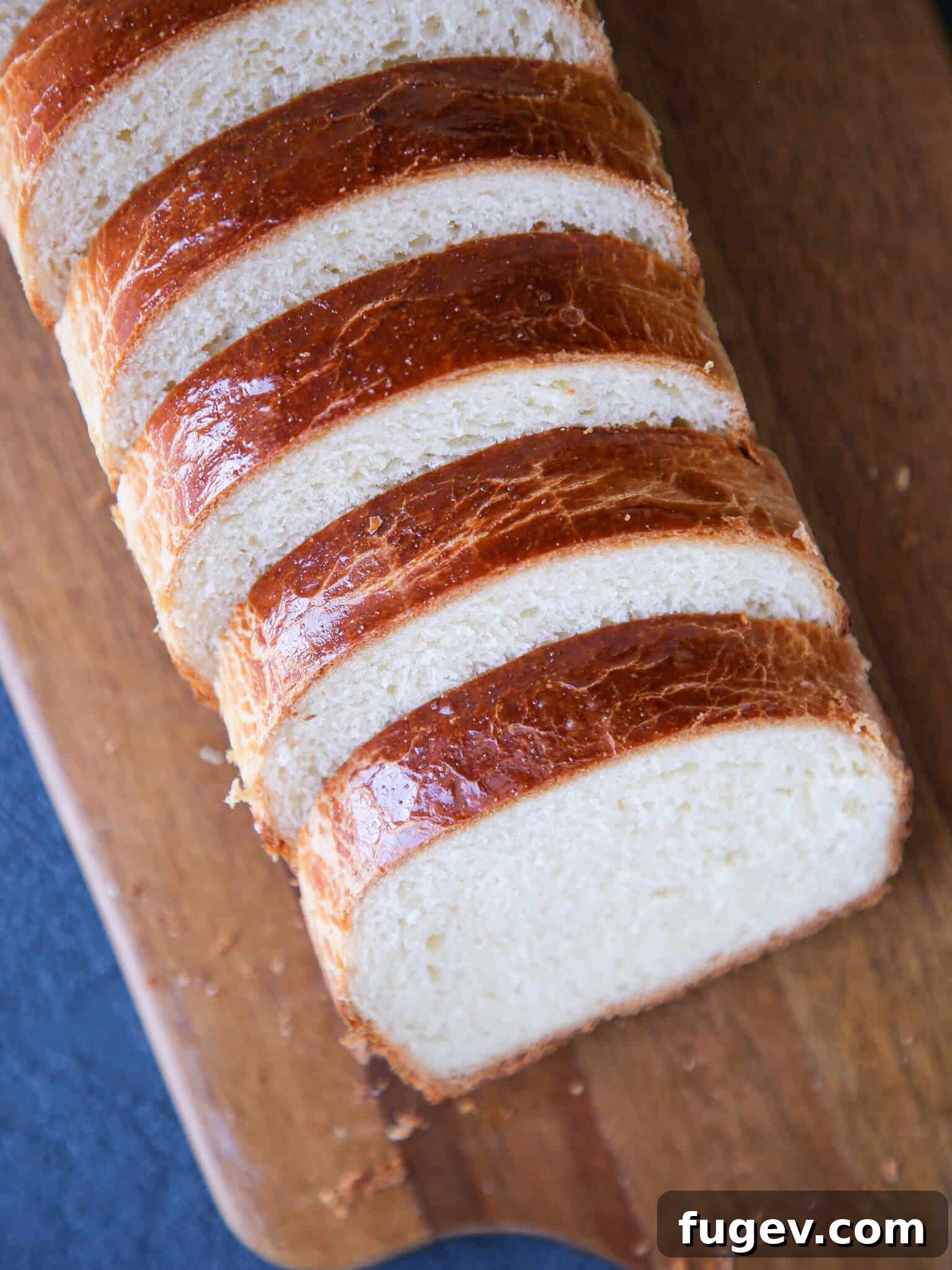 Golden Buttery Brioche Loaf 2 Brioche Bread sliced and shingled, showcasing its tender crumb.