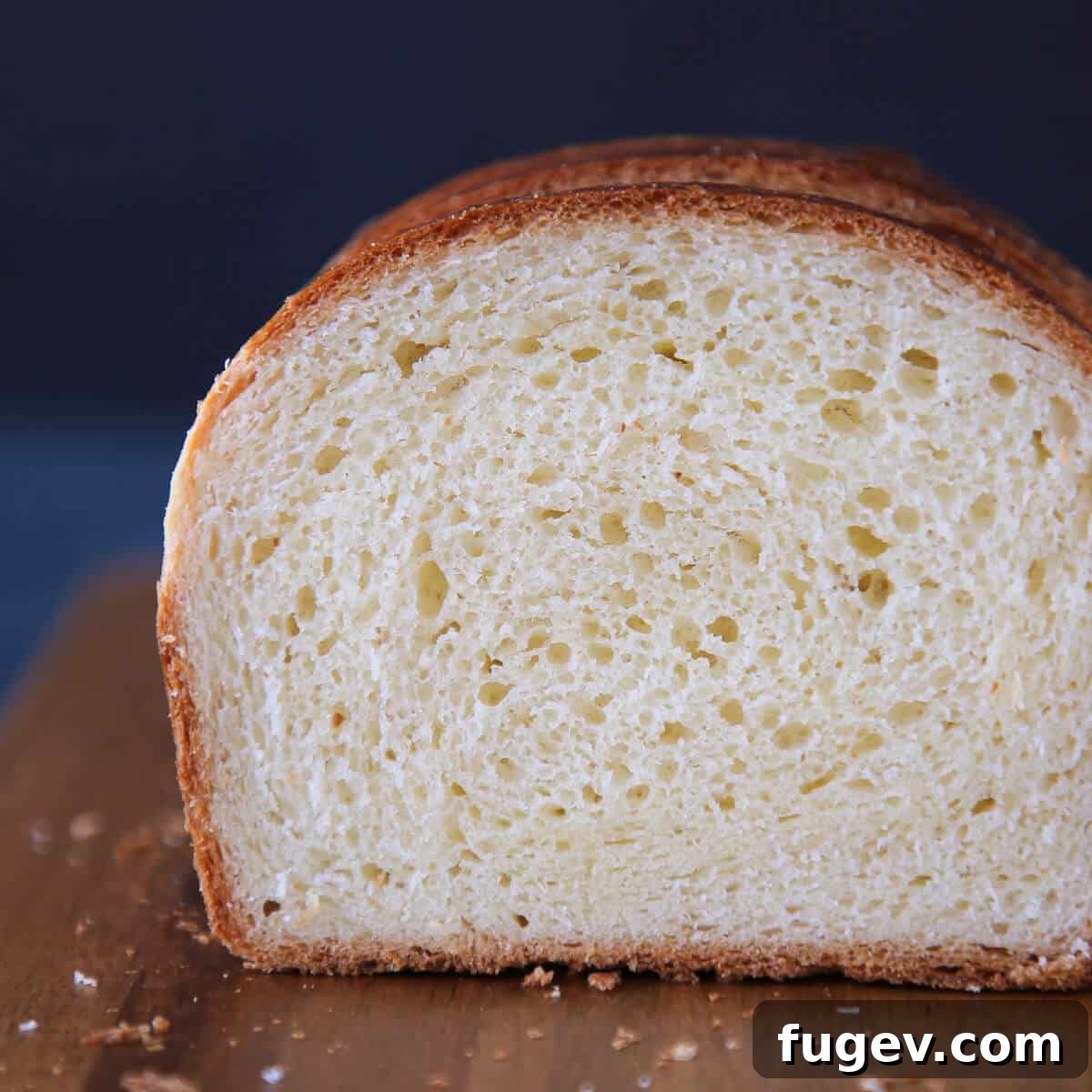 Golden Buttery Brioche Loaf 3 Close-up of Brioche Bread's tender crumb, revealing its soft and airy texture.