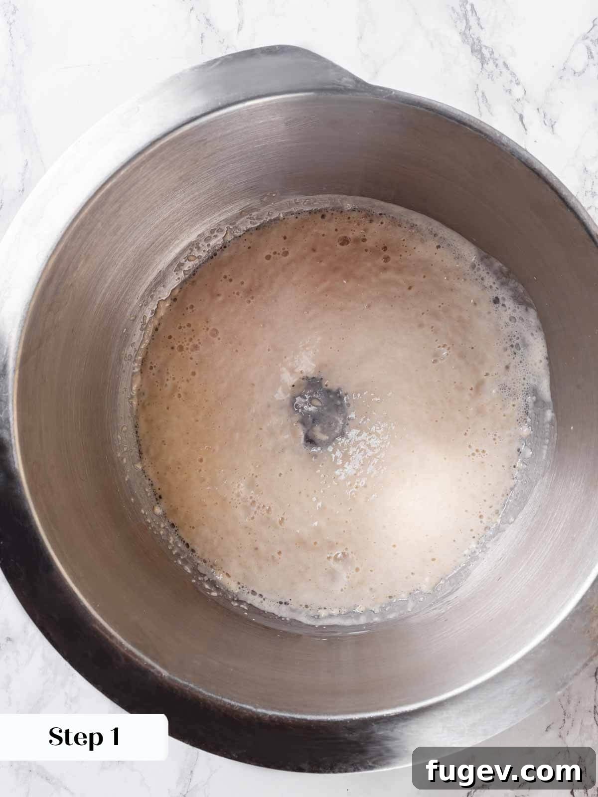 Golden Buttery Brioche Loaf 5 Yeast blooming in a bowl, showing active fermentation with bubbles.