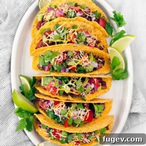 Delicious Ground Beef Tacos ready to serve with fresh toppings
