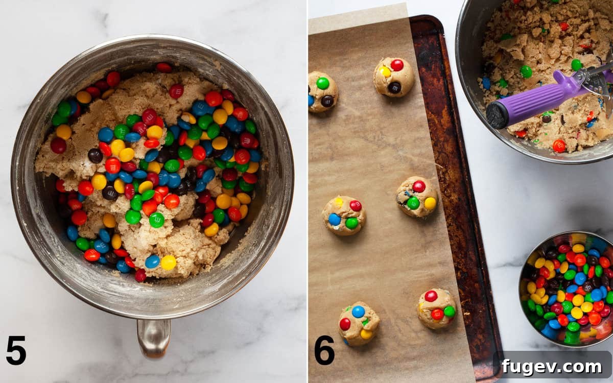 Chewy Peanut Butter Chocolate Candy Cookies 6 On the left, M&Ms are mixed into the peanut butter cookie dough. On the right, portioned cookie dough balls with M&Ms pressed on top are arranged on a parchment-lined baking sheet.