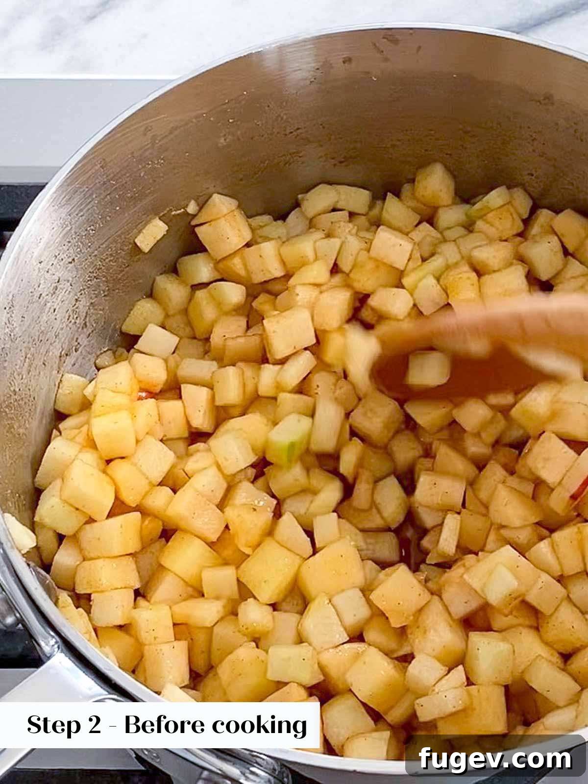 Flaky Apple Turnovers 5 Cinnamon apple filling simmering in a pot on the stovetop, releasing its juices and thickening.
