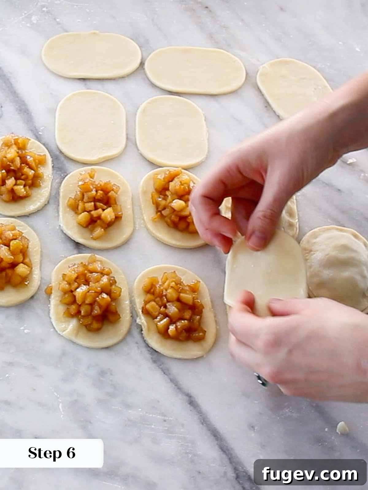 Flaky Apple Turnovers 9 Carefully placing a dollop of apple filling onto pie dough, leaving a clean border for sealing.