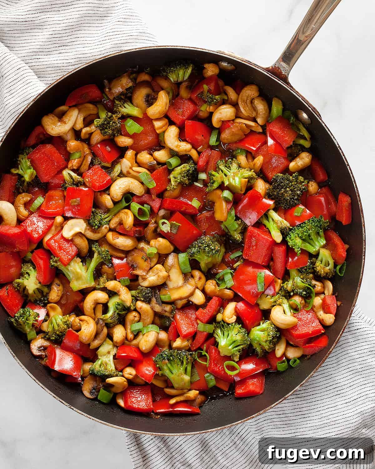 Golden Cashew Vegetable Wok 7 Finished veggie stir-fry cooking in a skillet, close up.