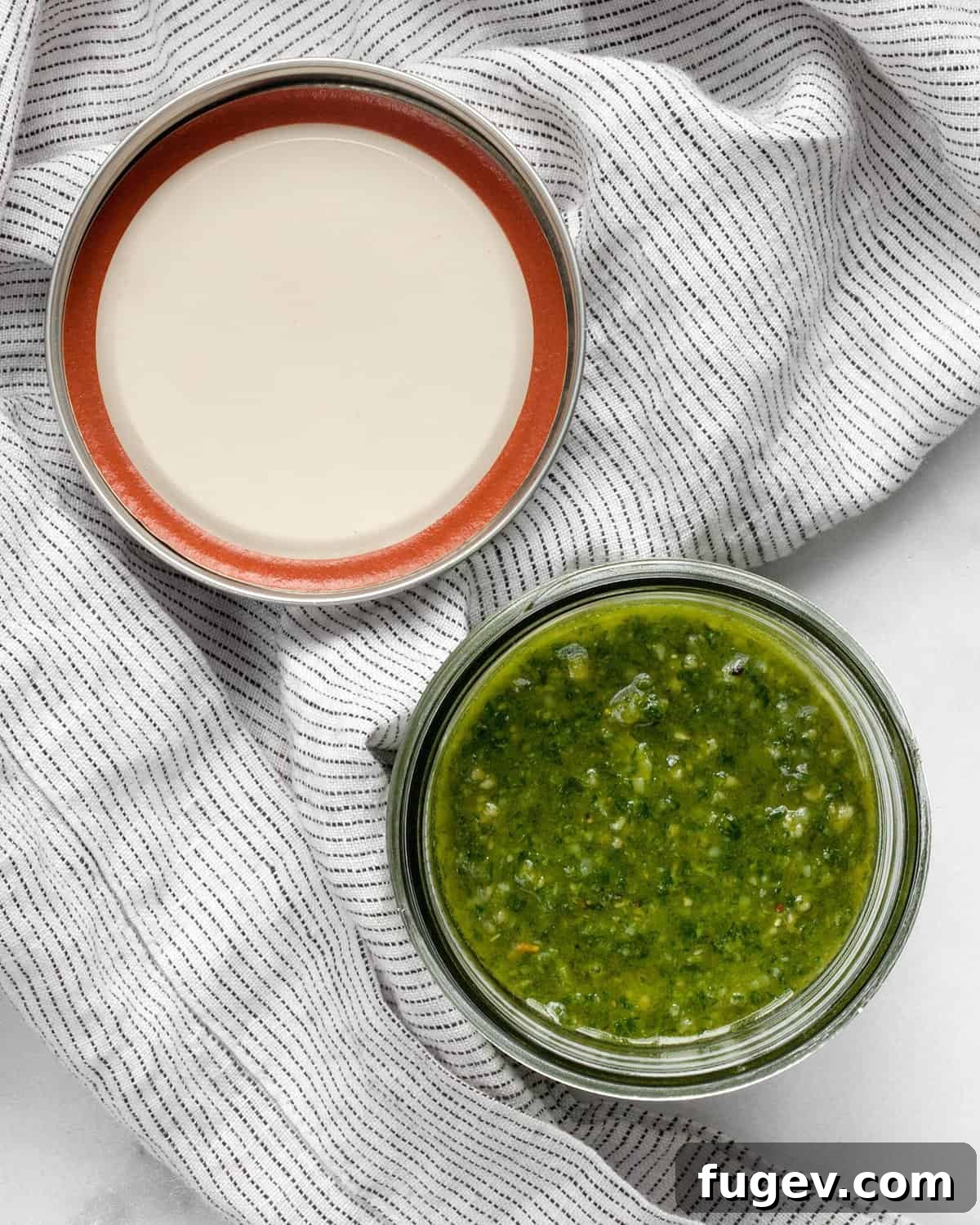 Homemade Pesto Perfection 4 A glass jar filled with vibrant green basil pesto, sealed with a lid and ready for storage.