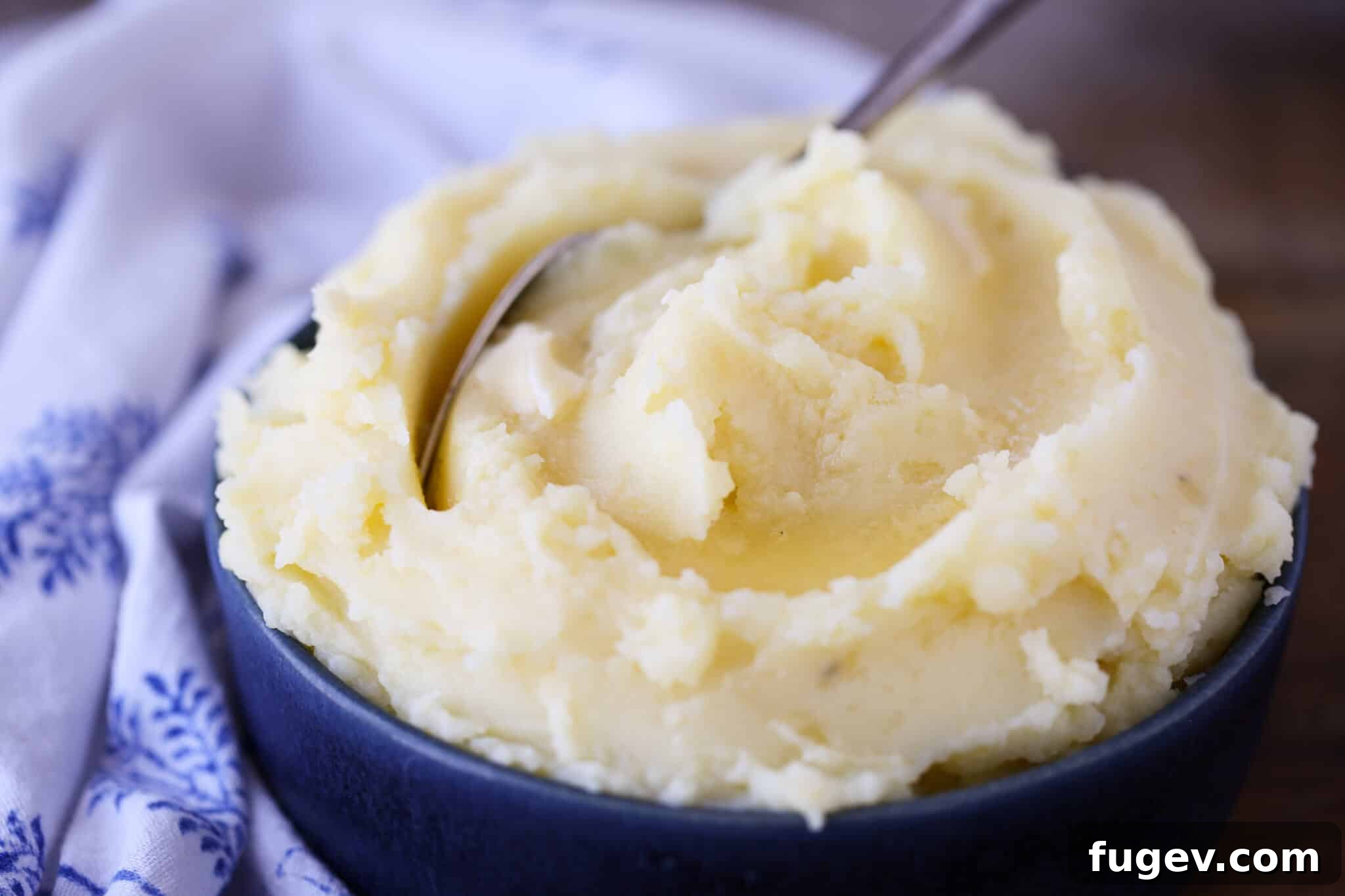 Velvety Mashed Potatoes 3 Creamy Mashed Potatoes in a blue bowl with a blue napkin