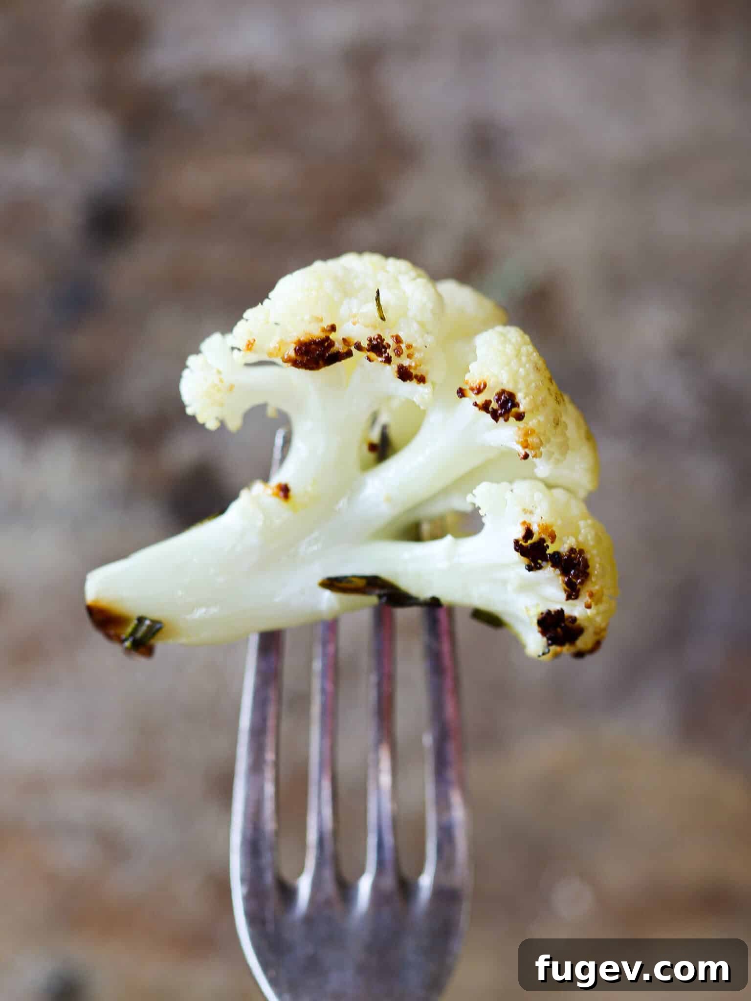 Zesty Rosemary Lemon Roasted Cauliflower 3 Easy Rosemary Lemon Roasted Cauliflower on fork