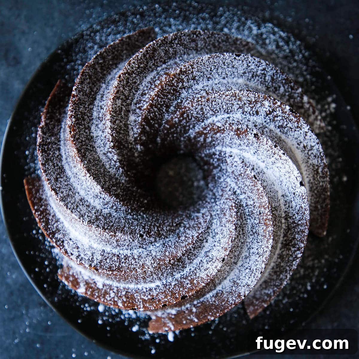 Decadent Chocolate Pound Cake 3 An uncut fluted chocolate pound cake.