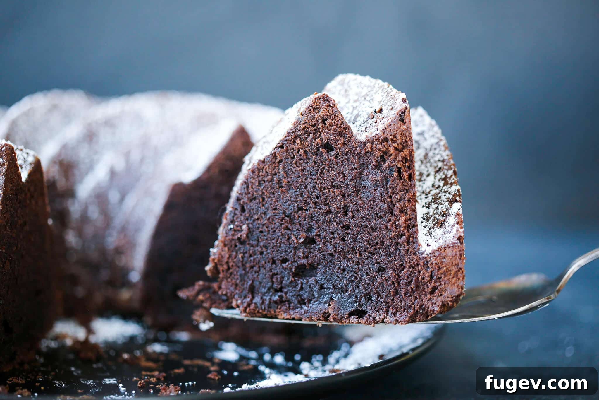 Decadent Chocolate Pound Cake 4 A slice of chocolate pound cake on a vintage cake server.