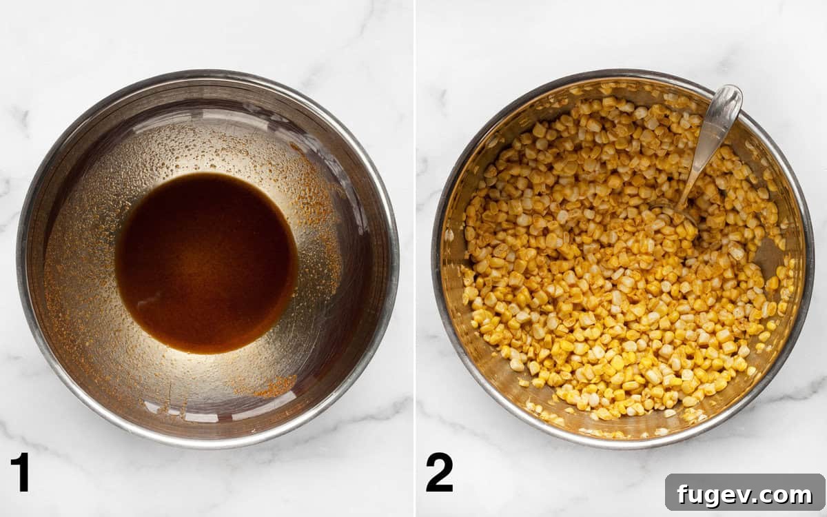 Smoky Roasted Corn Salad 4 Raw corn kernels being stirred into a bowl with olive oil and a vibrant blend of cumin, chili powder, and paprika.