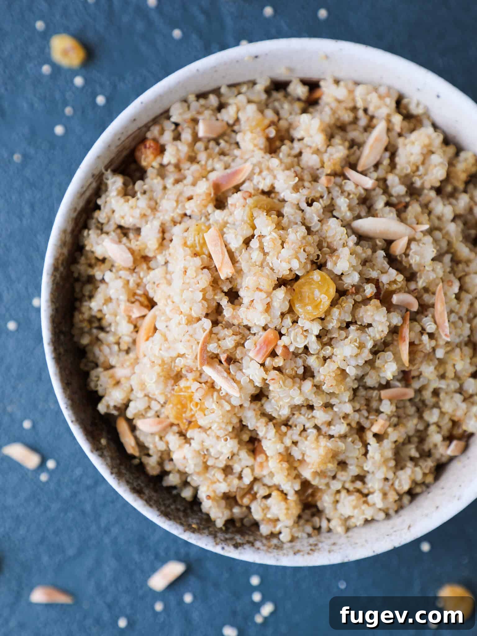Quinoa Pilaf Overhead View Quinoa Pilaf Blue Background - A delightful, aromatic gluten-free side dish.