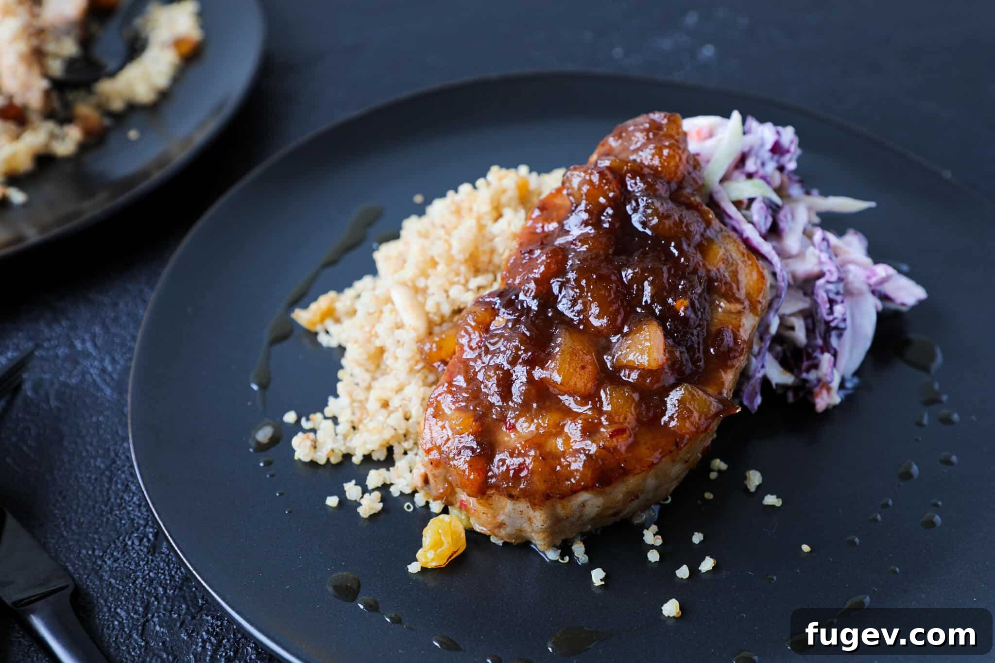 Spicy Peach Pork Chops Side View with Quinoa Pilaf Spicy Peach Pork Chops Plated with Quinoa Pilaf