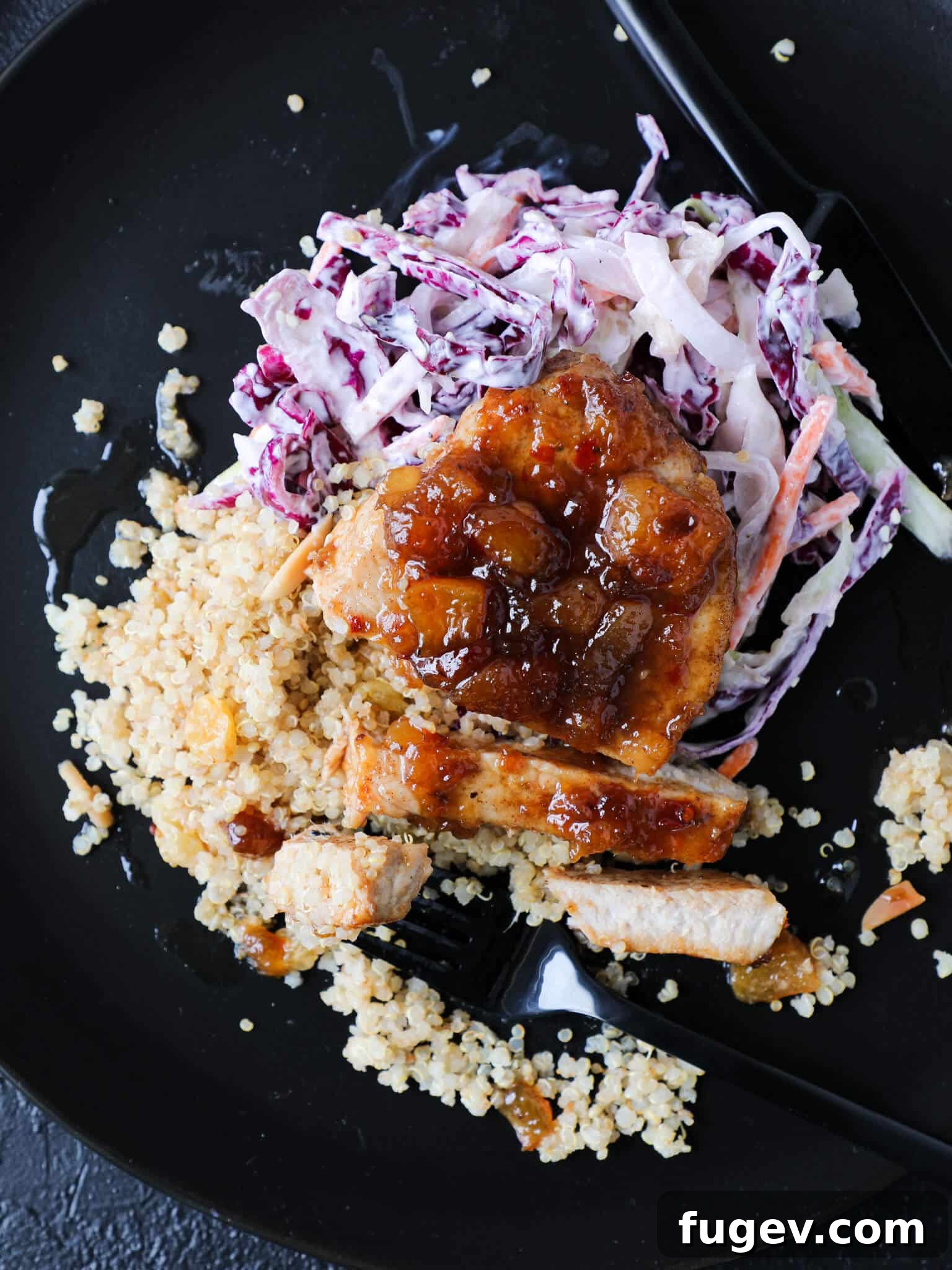 Sweet Heat Peach Pork Chops 2 Perfectly seared Spicy Peach Pork Chops glazed with a rich, vibrant sauce, garnished with fresh herbs, ready to be served.