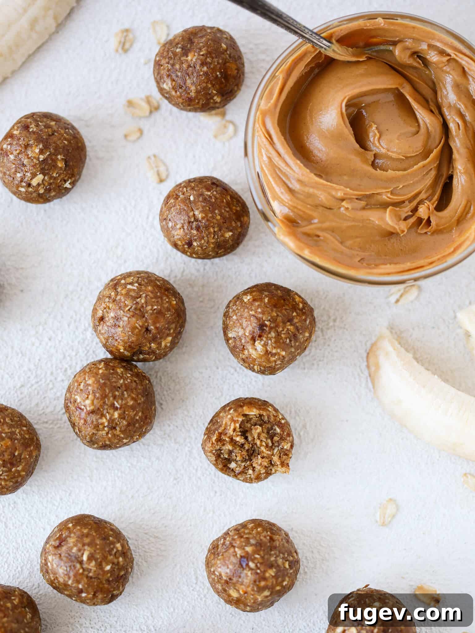Peanut Butter Banana Fuel Poppers 2 Peanut Butter Banana Energy Bites Overhead - A delicious and healthy no-bake snack for on the go.