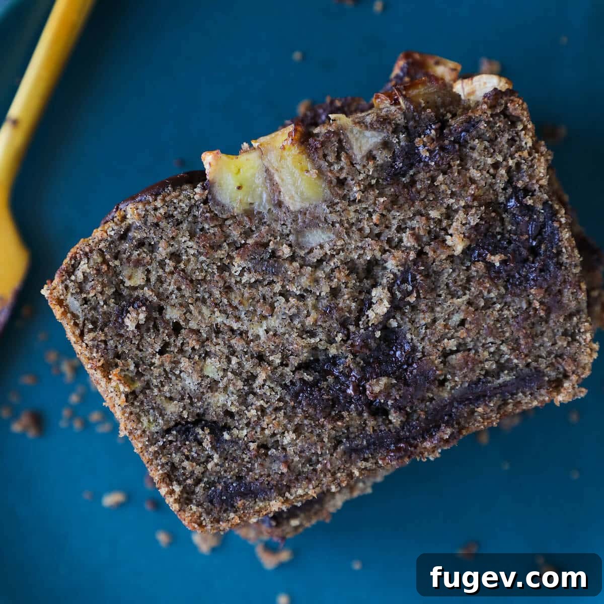 Irresistible Vegan Chocolate Chip Banana Loaf 3 Close-up of the tender crumb of Vegan Gluten-Free Chocolate Chip Buckwheat Banana Bread on a cooling rack
