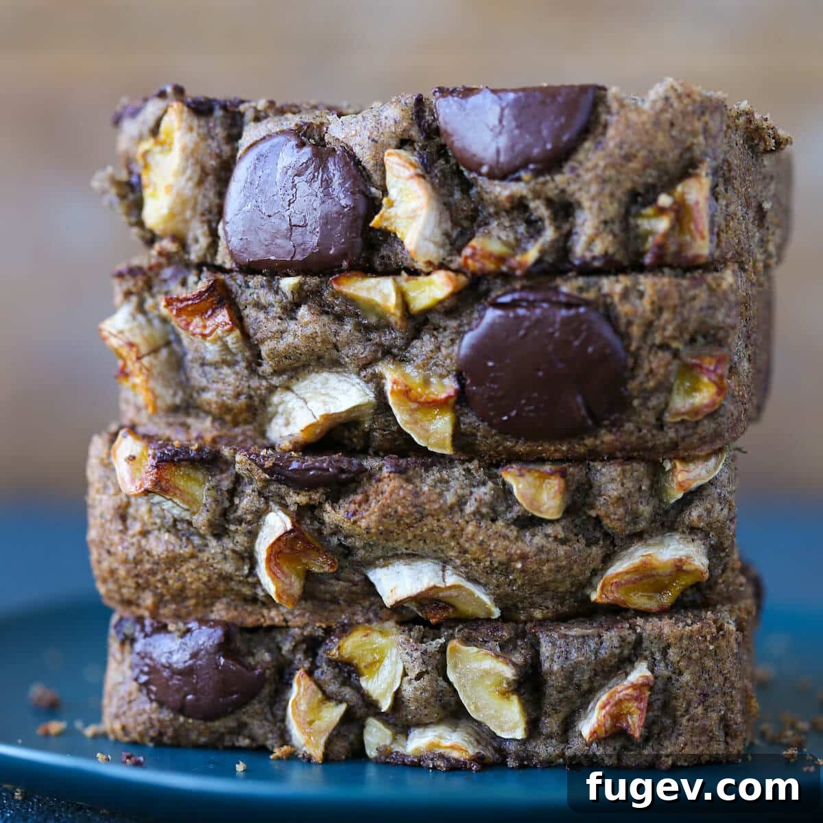 Irresistible Vegan Chocolate Chip Banana Loaf 6 Stacked slices of Vegan Gluten-Free Chocolate Chip Buckwheat Banana Bread on a white plate