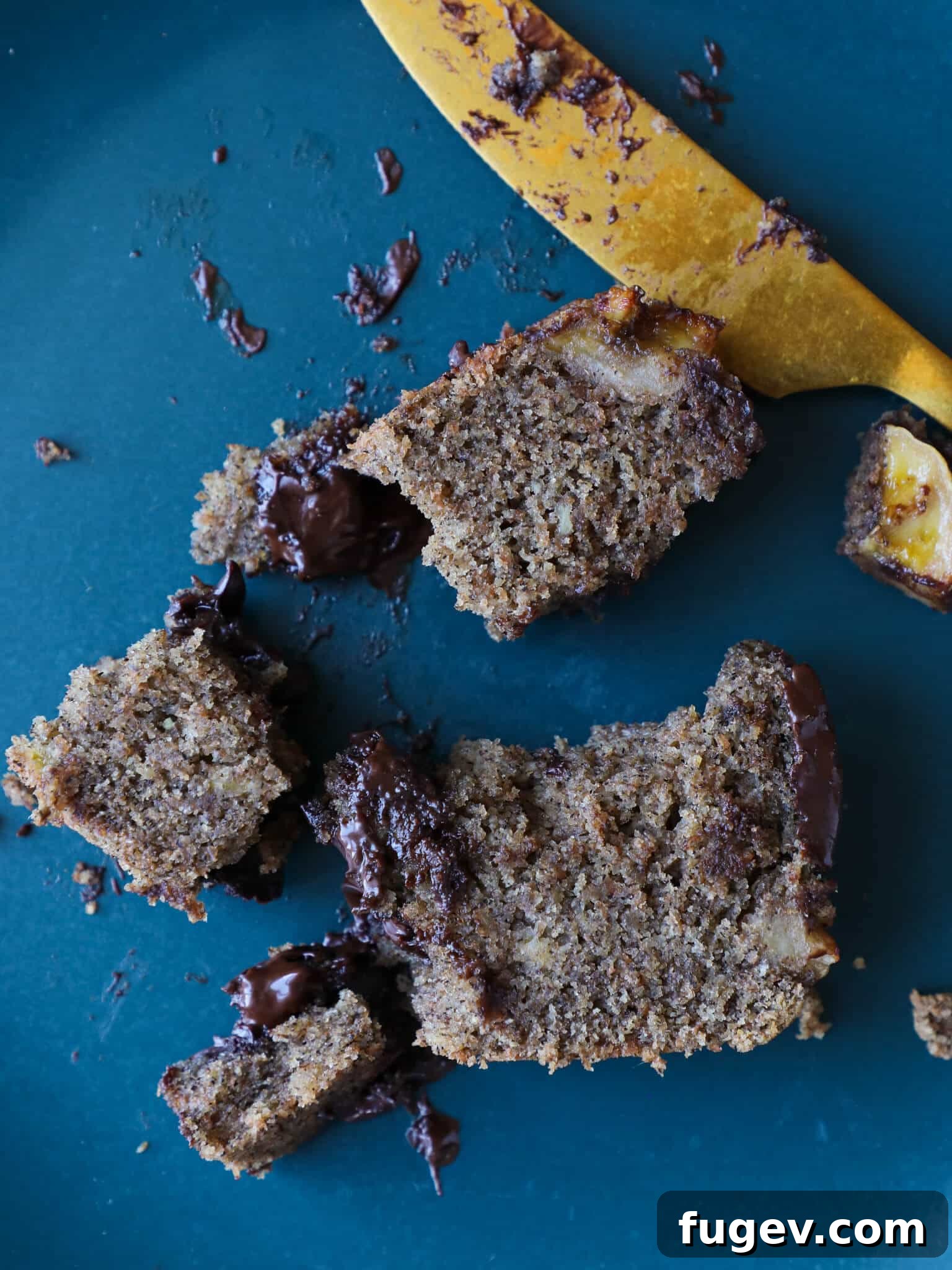 Irresistible Vegan Chocolate Chip Banana Loaf 7 Person enjoying a slice of Vegan Gluten-Free Chocolate Chip Buckwheat Banana Bread with a fork