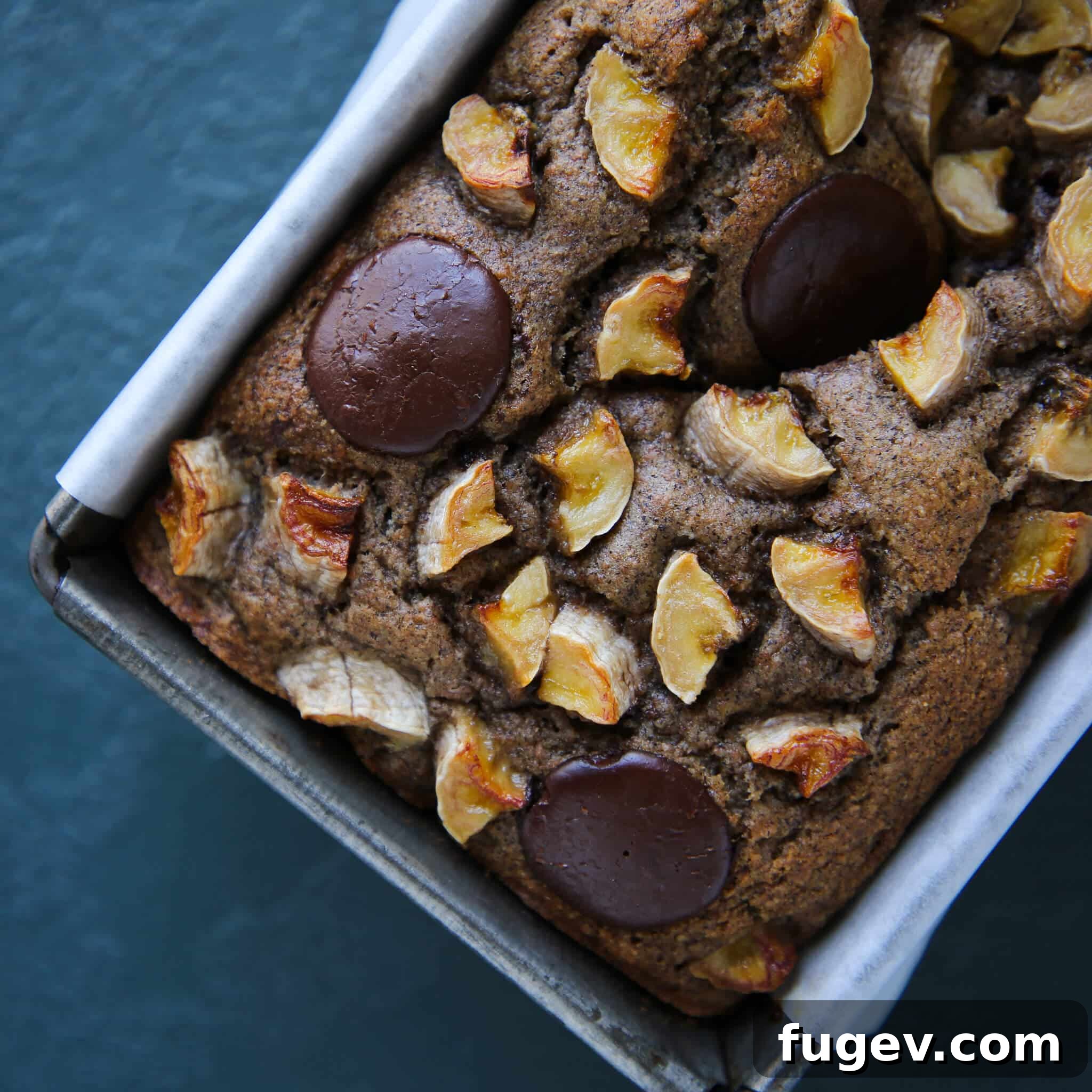 Irresistible Vegan Chocolate Chip Banana Loaf 8 Top view of Vegan Gluten-Free Chocolate Chip Buckwheat Banana Bread with banana slices and chocolate chips on top