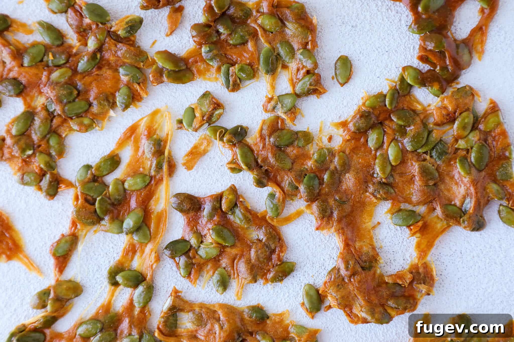 Roasted Pumpkin Seed Crunch 4 Pumpkin Seed Brittle Spread Out on Silicone Mat