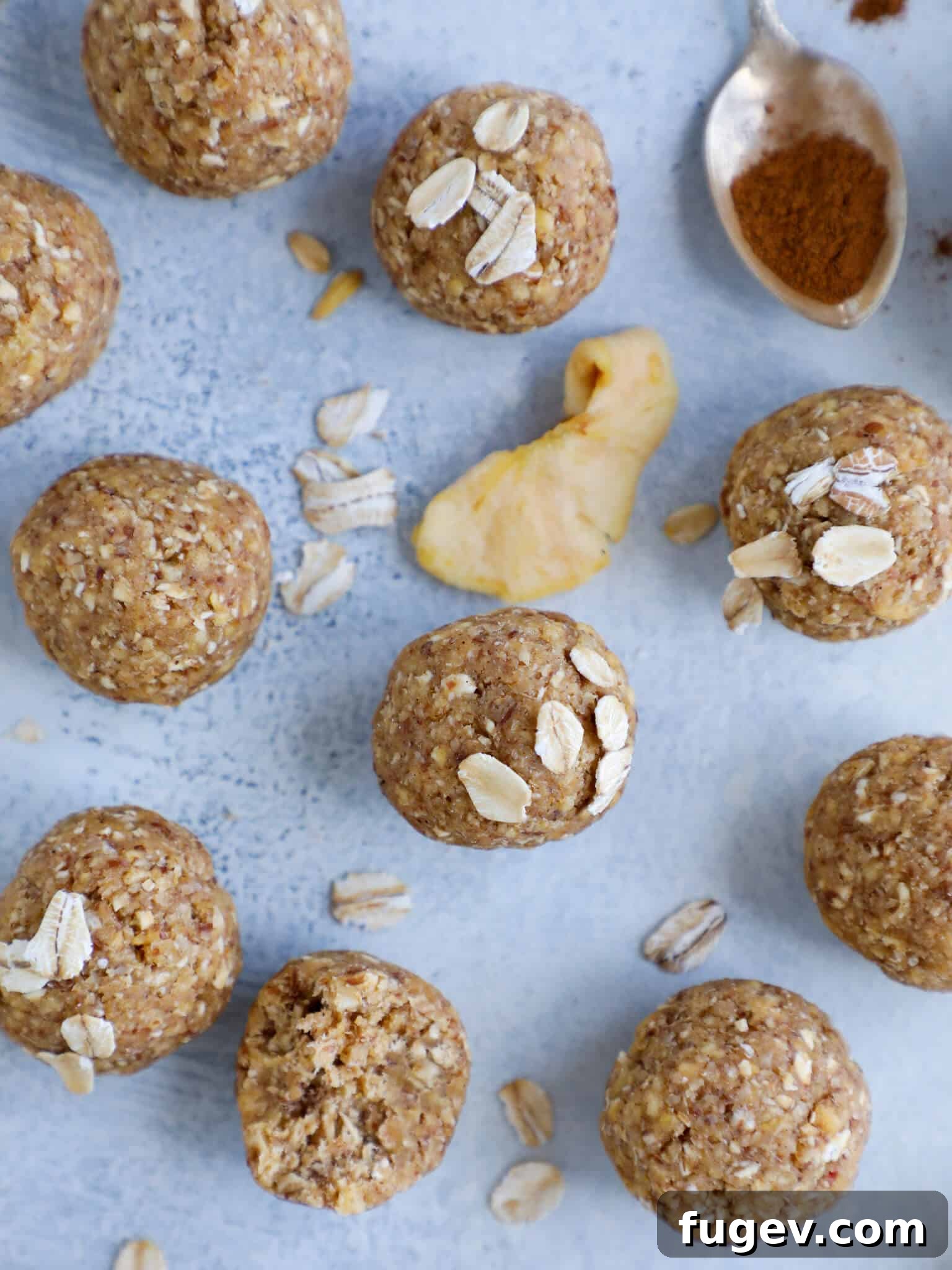 Apple Crisp Power Bites 5 A group of healthy Apple Crisp Energy Bites on a plate